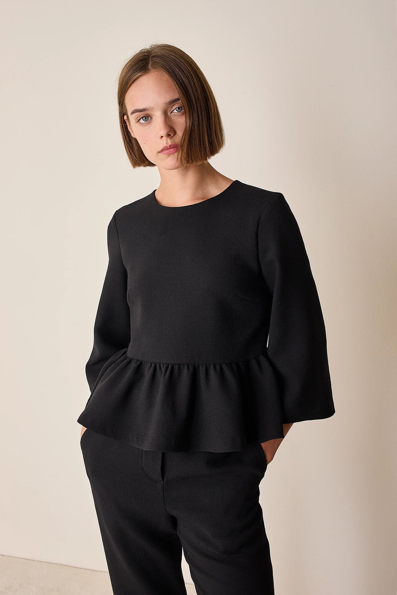 Stretch wool top with ruffle