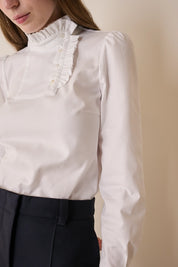 Top con abbottonatura laterale