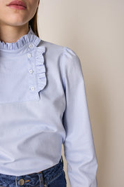 Top con abbottonatura laterale