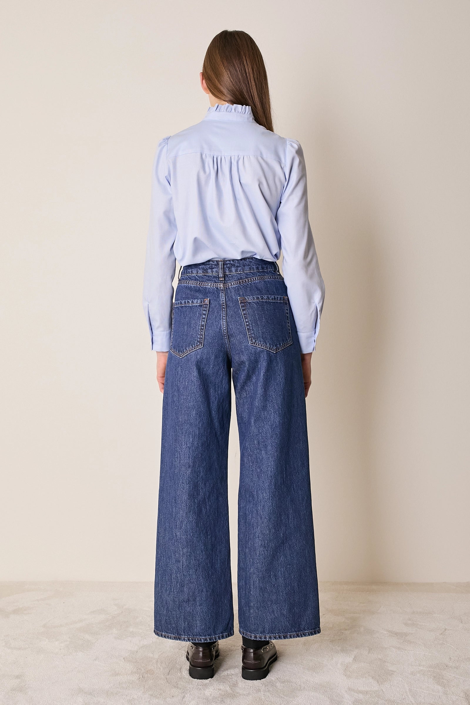 Top con abbottonatura laterale