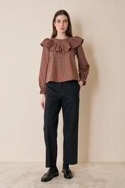 Top a quadretti con maxi volant