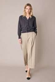 Pantaloni con piega e risvolto