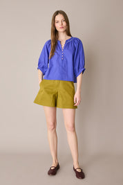 Top con bottoni rivestiti