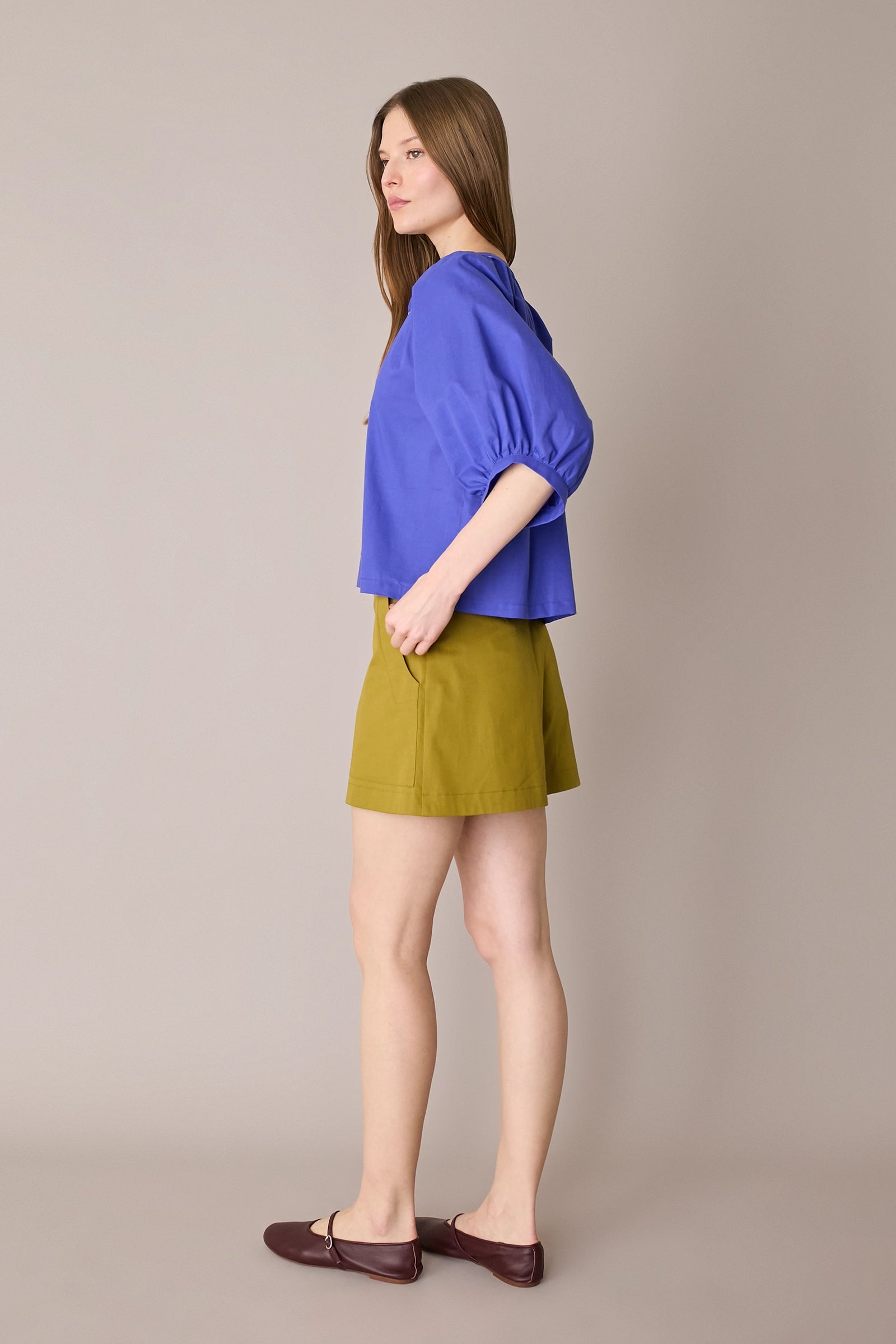 Top con bottoni rivestiti