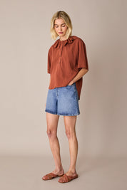 Ruffled polo top