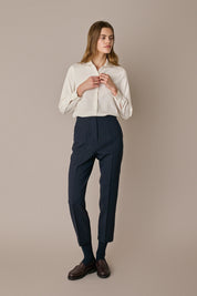 Pantaloni con piega in lana e seta