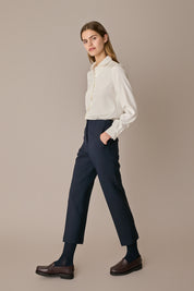 Pantaloni con piega in lana e seta