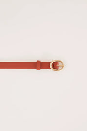 Thin leather belt with gold oval buckle