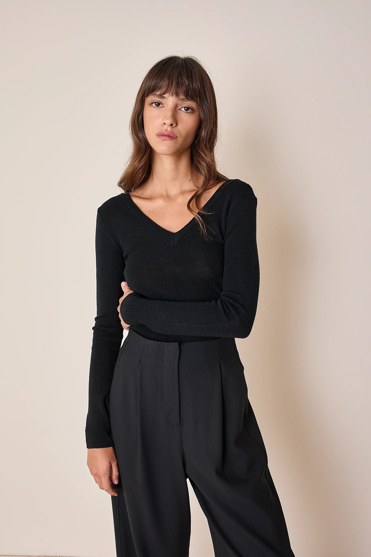 Sweater with V-neck on the back