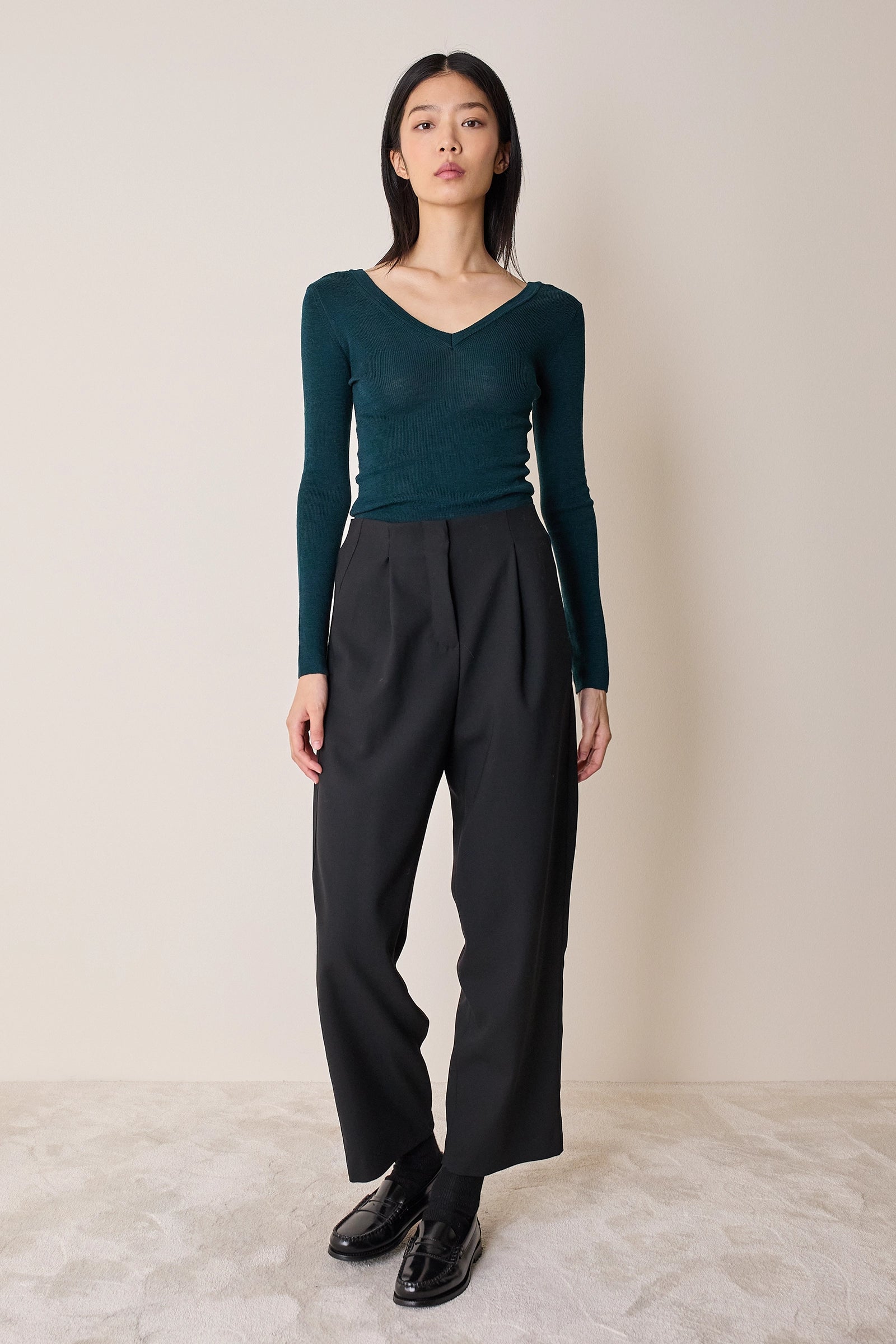 Pullover con scollo a V sulla schiena