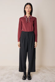 Polo con volant e bottoncini a sfera