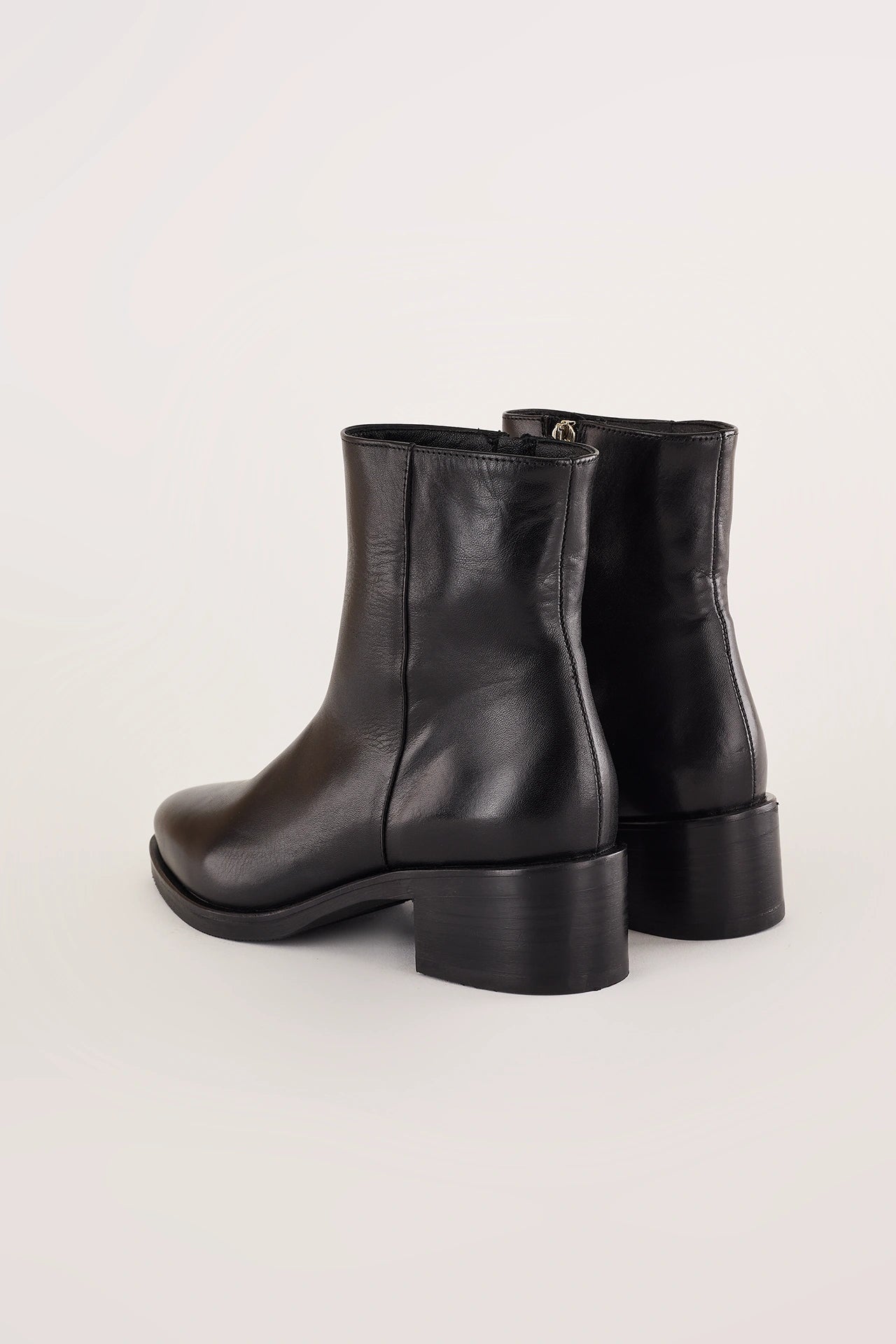 Pointed toe ankle boots with low heel