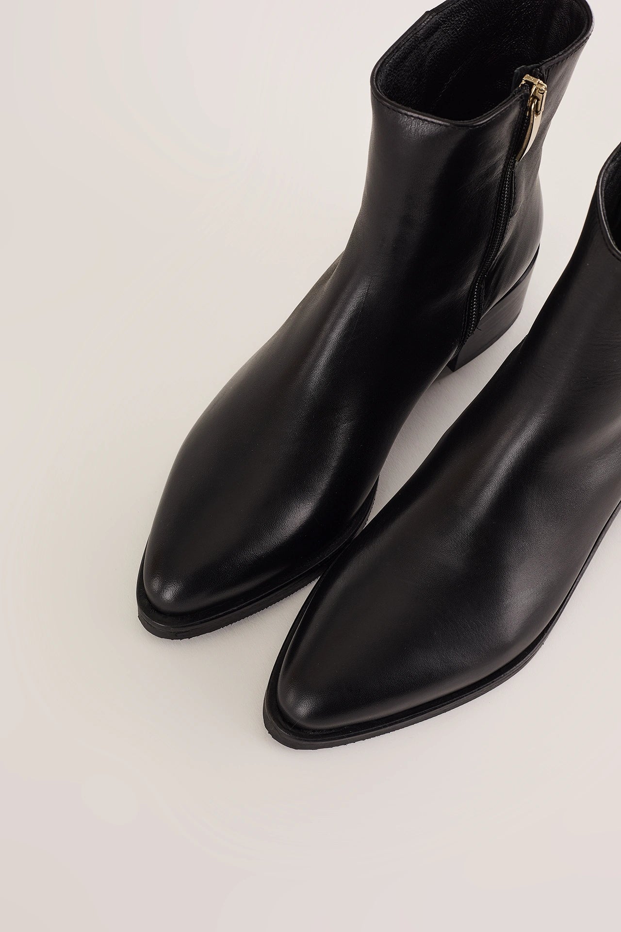 Pointed toe ankle boots with low heel
