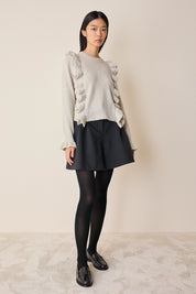 Maglia in lana con volants