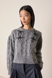 Maglione con fiocchi in velluto