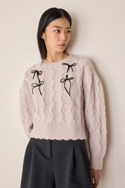 Maglione con fiocchi in velluto